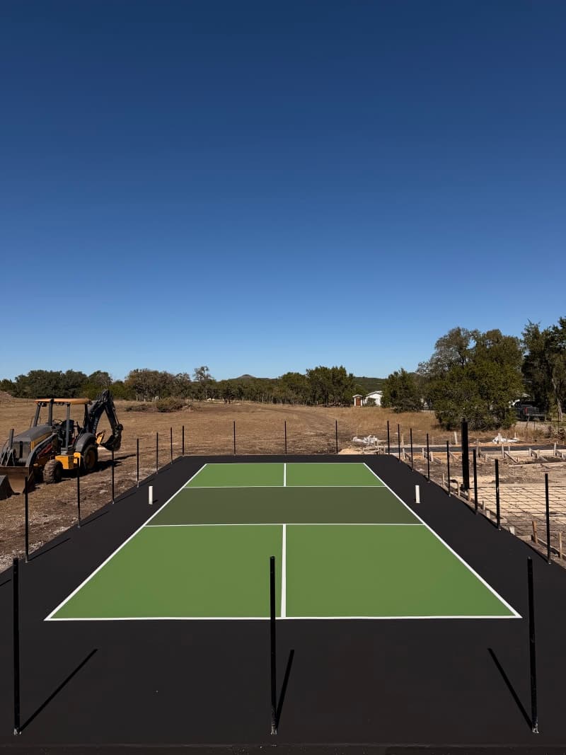 Three-color custom court resurfacing with professional pickleball lines in Wimberley Texas