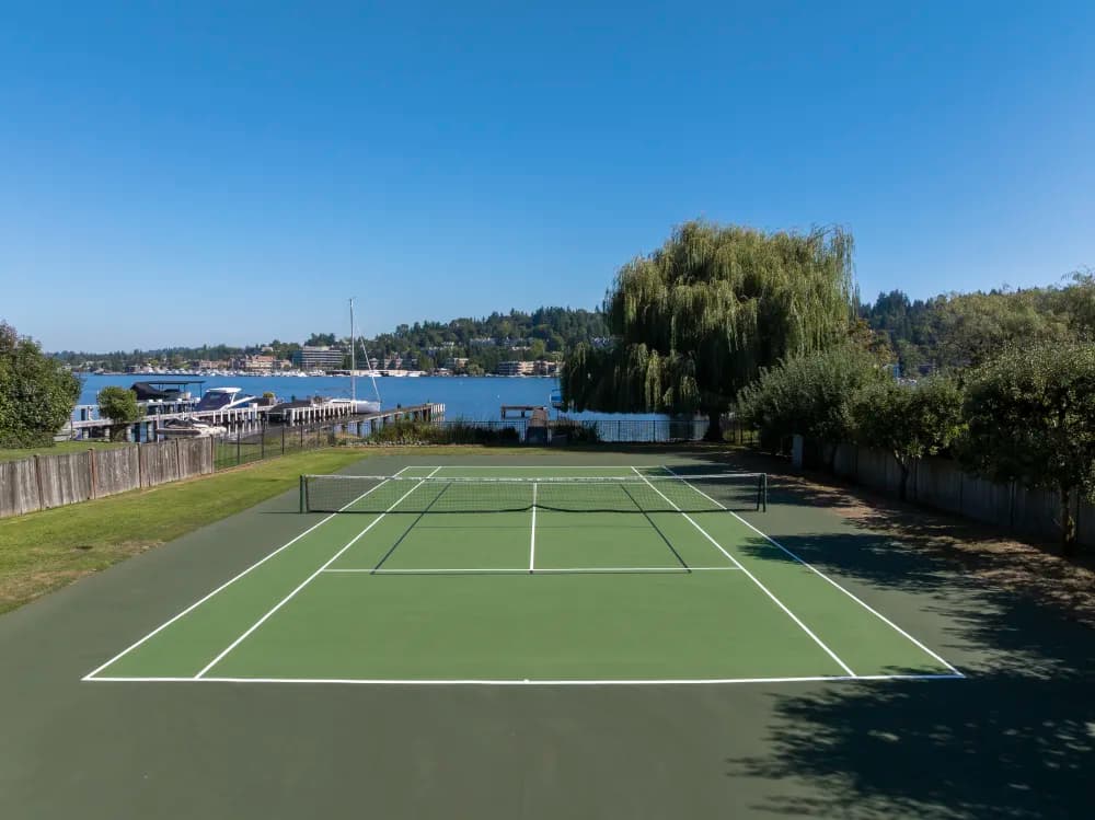 Aerial view of a freshly resurfaced tennis court in blue and green