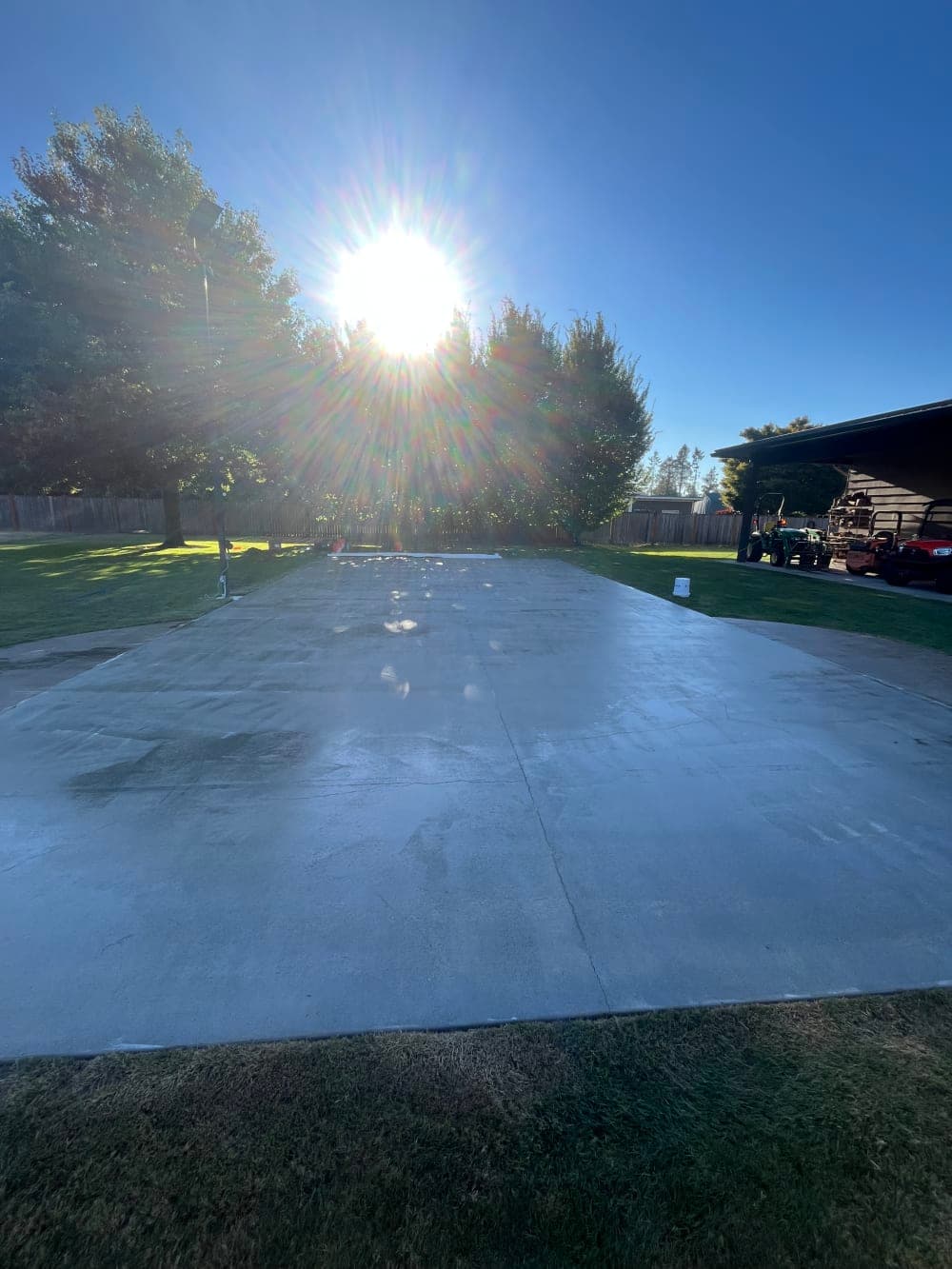 Concrete court slab pressure-washed and cleaned before surfacing in Sumner, Washington